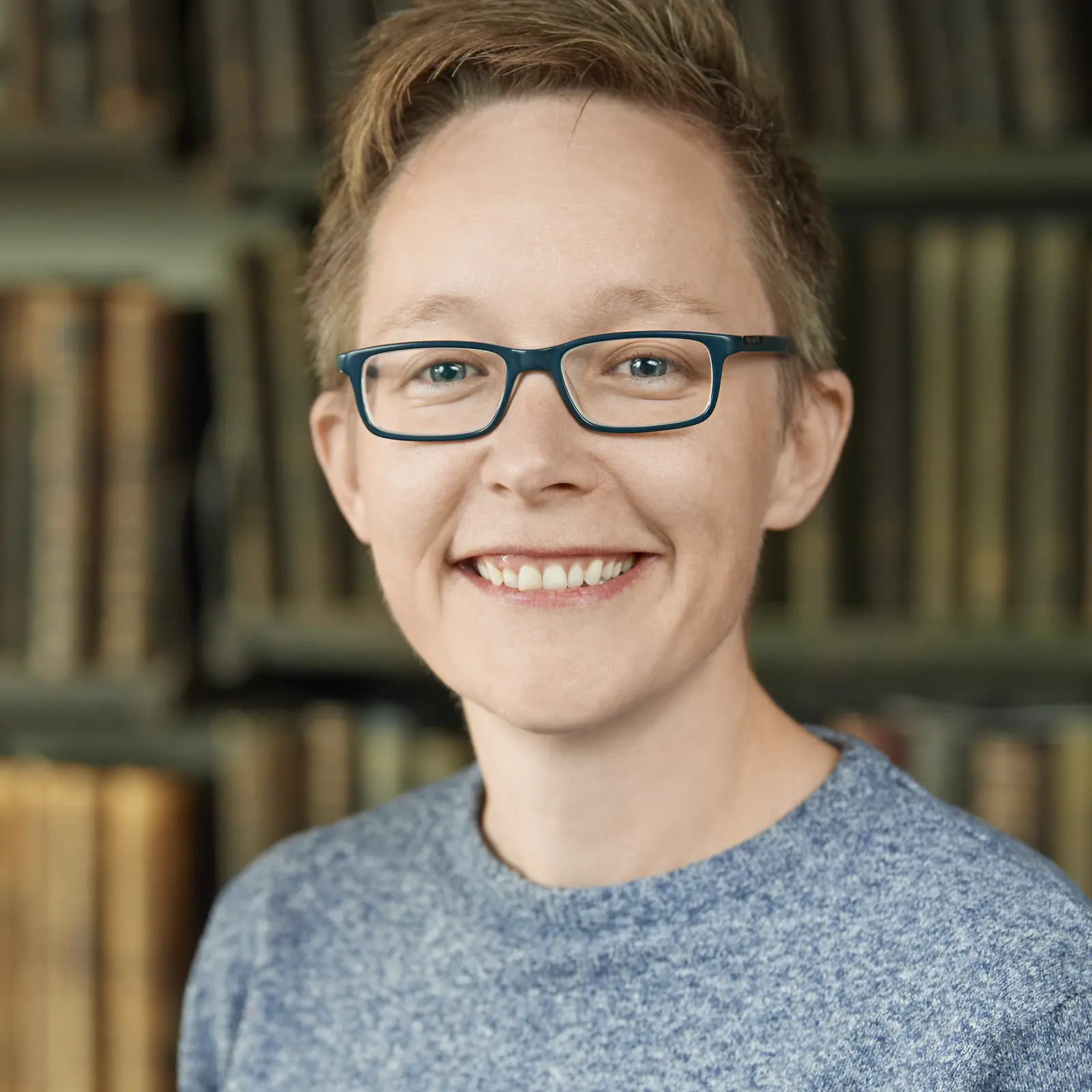 Headshot image of Mel in her workplace, on-site business photograph