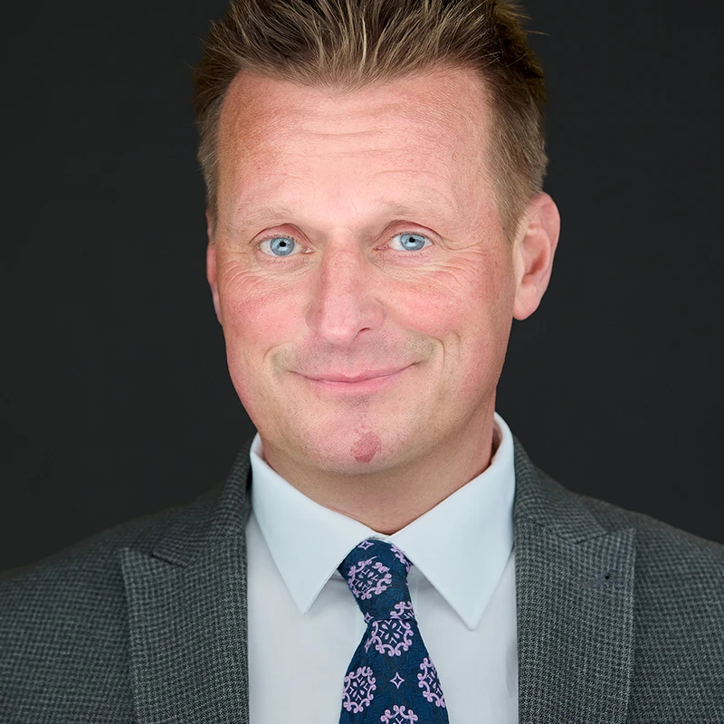 Professional headshot photography in Falmouth, Cornwall with confident, natural expressions for business professionals.