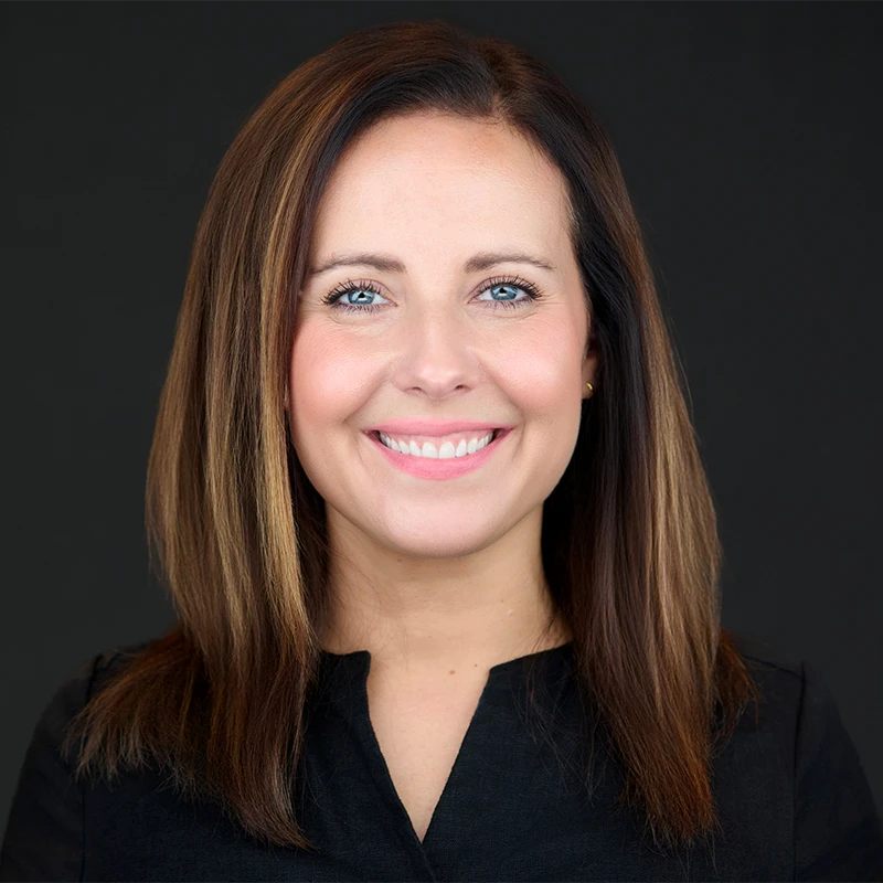 Plymouth Headshot Photographer | Hero Plymouth business headshots — confident, approachable portraits on a dark studio background