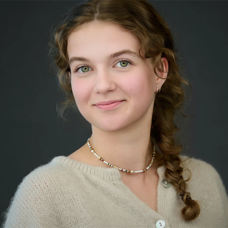 Relaxed on-location headshot session showing a calm, confident expression in an office setting