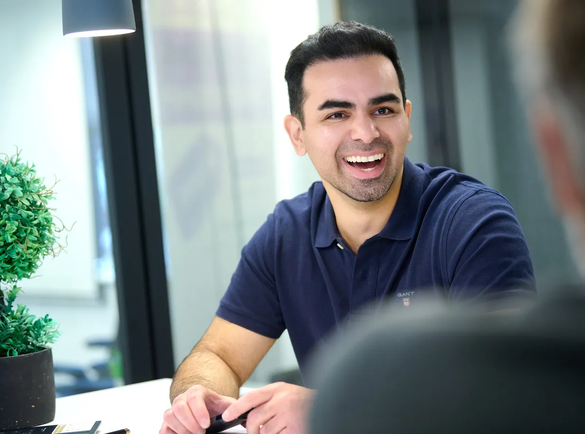Personal branding photo capturing a genuine laugh during a conversation