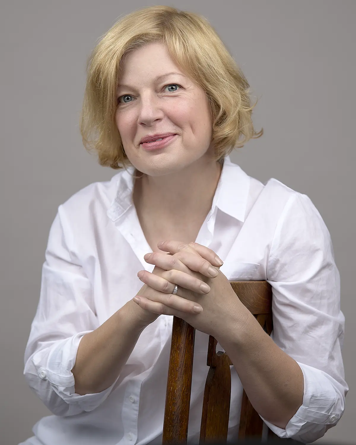 Professional Business Portrait of a blonde woman seated on a chair
