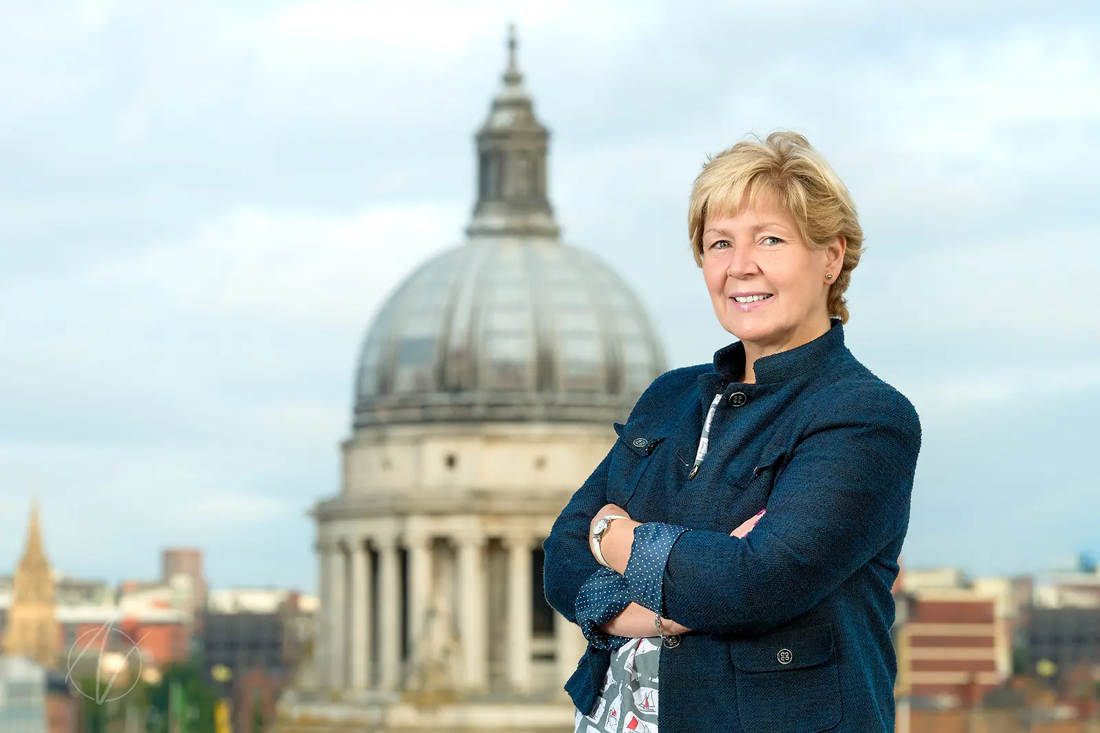 Personal branding photograph of a business woman captured in the city showing the context of her role.