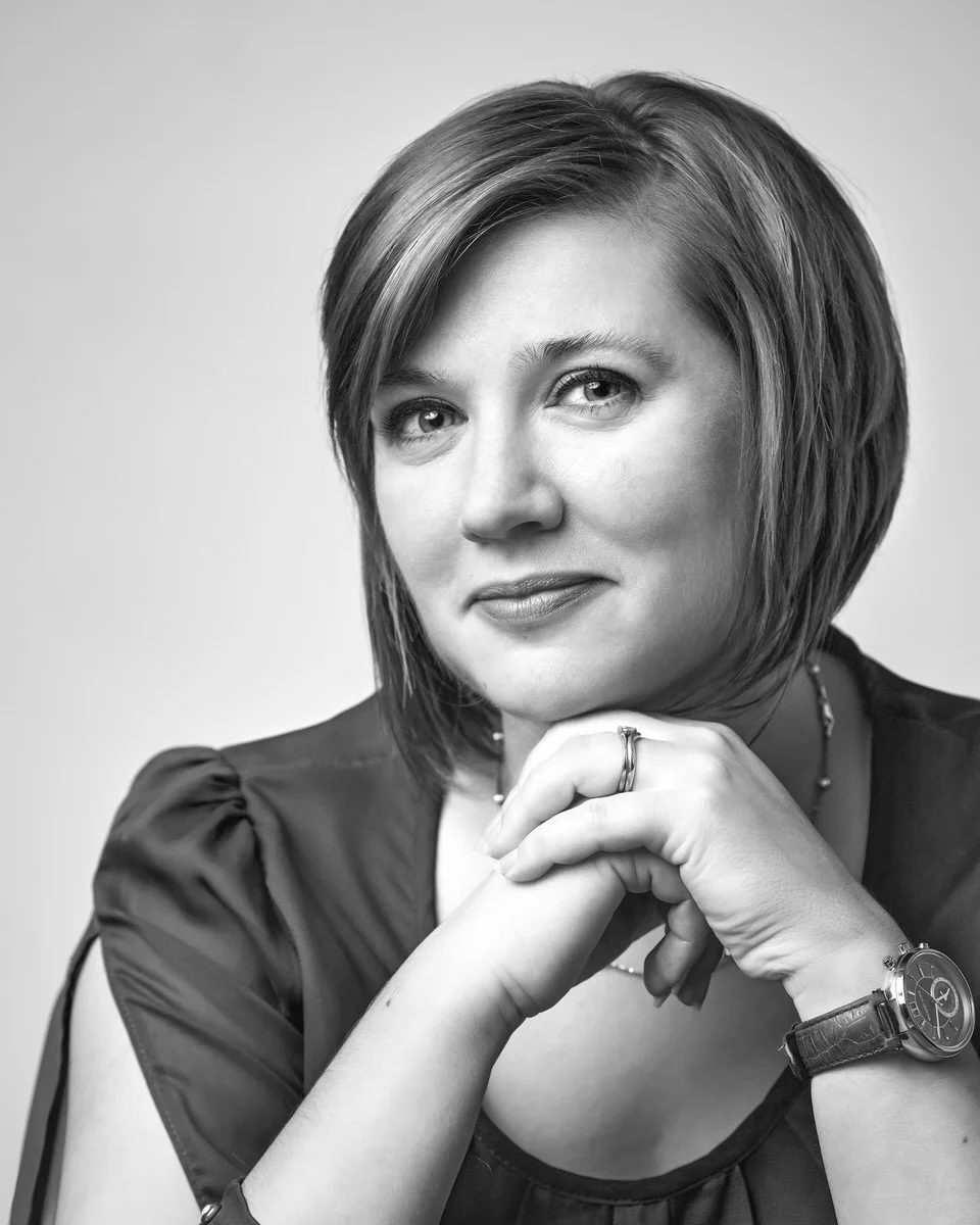 modern professional business monochrome headshot of a female client against a light background