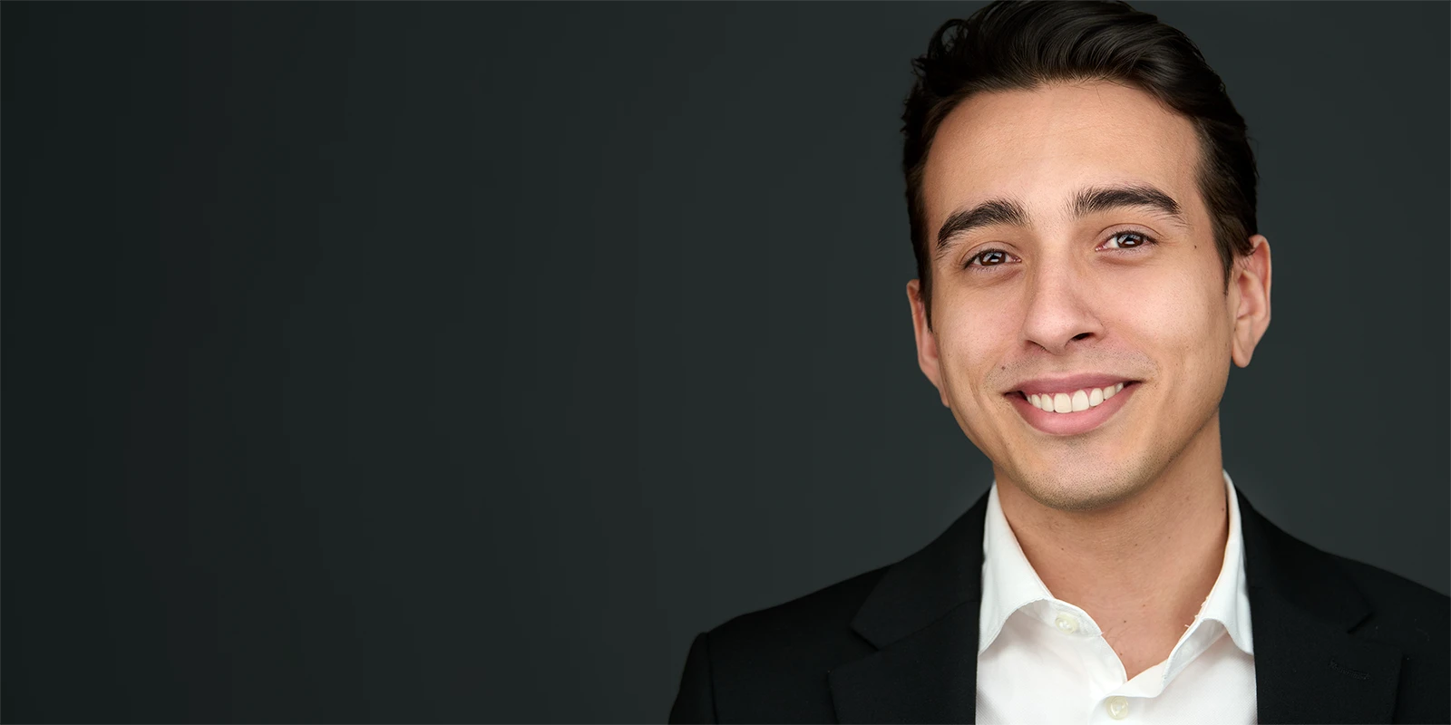 Professional headshot photographer working in Dorset, showing expert portrait lighting for local business professionals