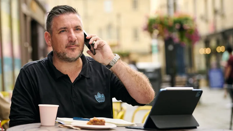 Brand photography capturing a relaxed professional in a natural, unposed moment