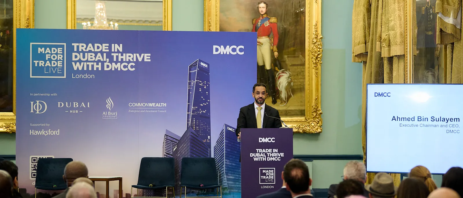 Ahmed Bin Sulayem, DMCC's Executive Chairman and CEO, speaking at a lectern in a gilt-framed room at 116 Pall Mall, in front of a Made for Trade Live London backdrop
