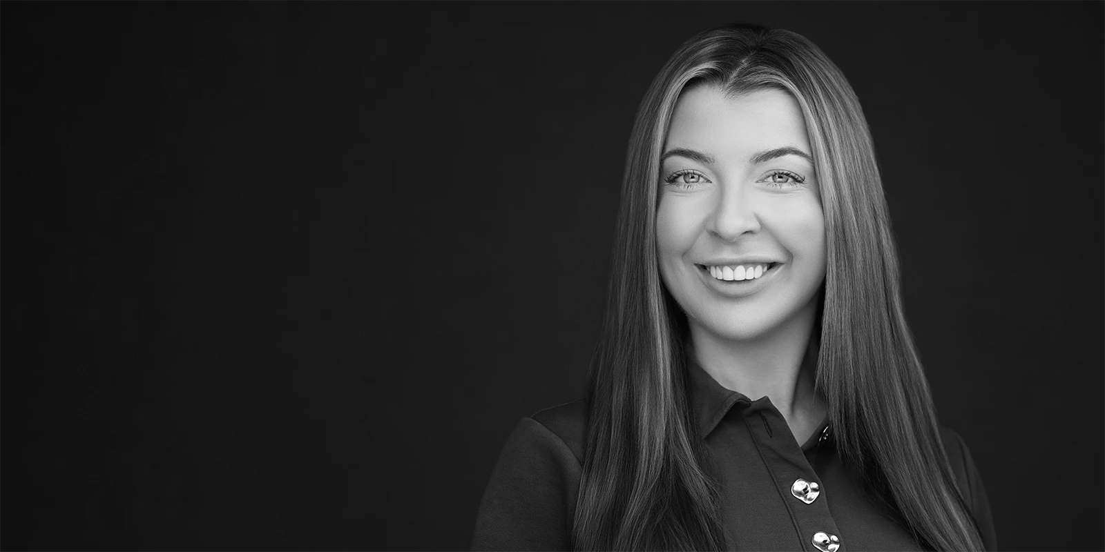 Natural, unposed expression captured during a professionally coached headshot session