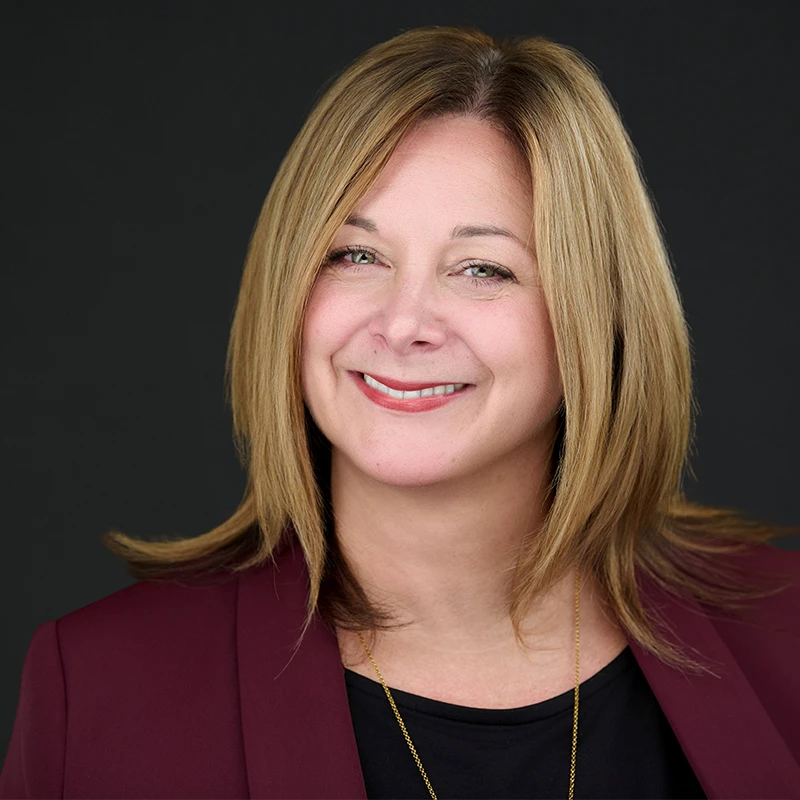 Professional wearing natural makeup that photographs clearly under studio lighting