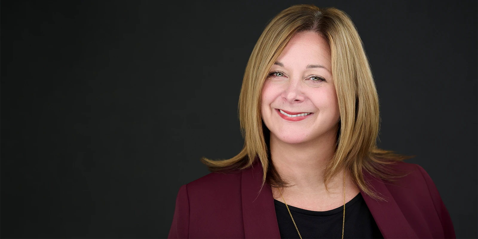 Professional wearing natural makeup that photographs clearly under studio lighting