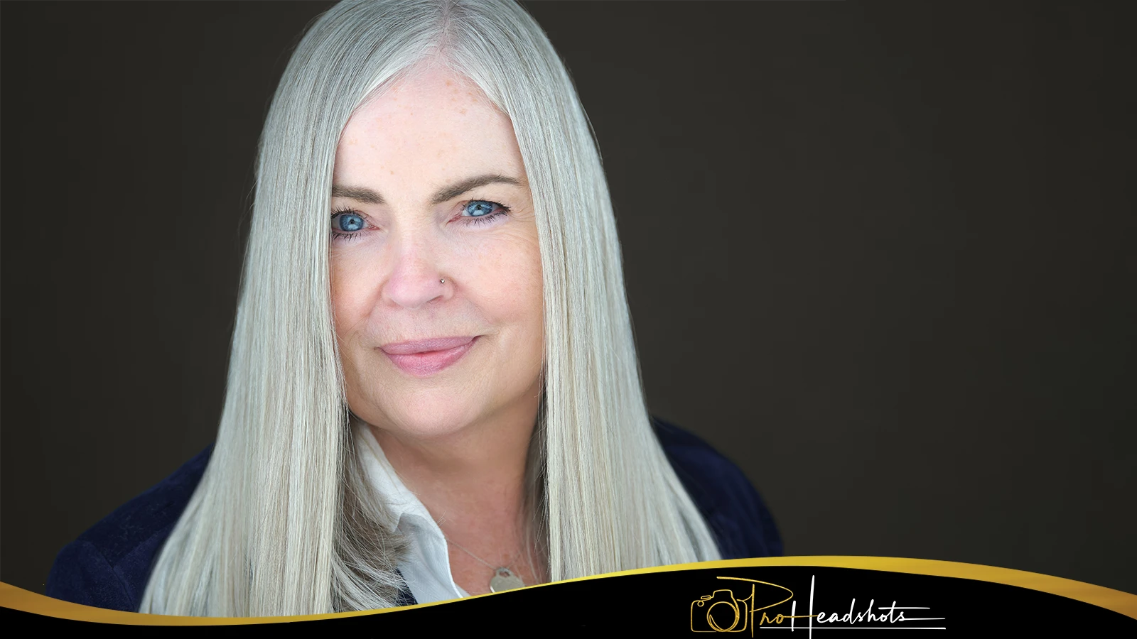 Professional appearing confident and natural after expression coaching during an office headshot session