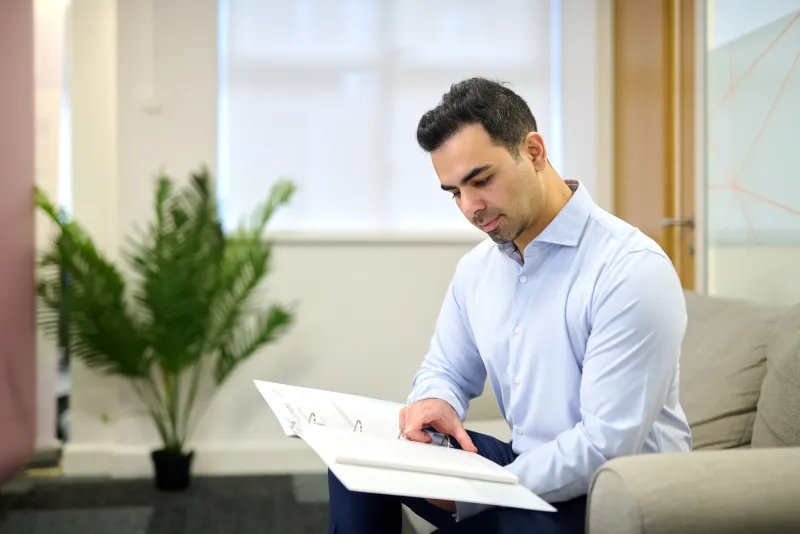 Ben Rahmani reviewing compliance documents, personal branding photography at YourSpace Bournemouth