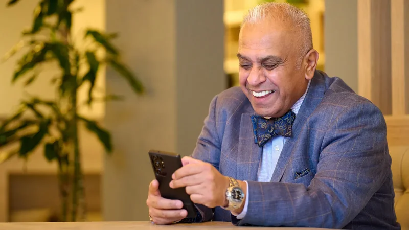 Christian Kumar laughing during a conversation, relaxed and approachable